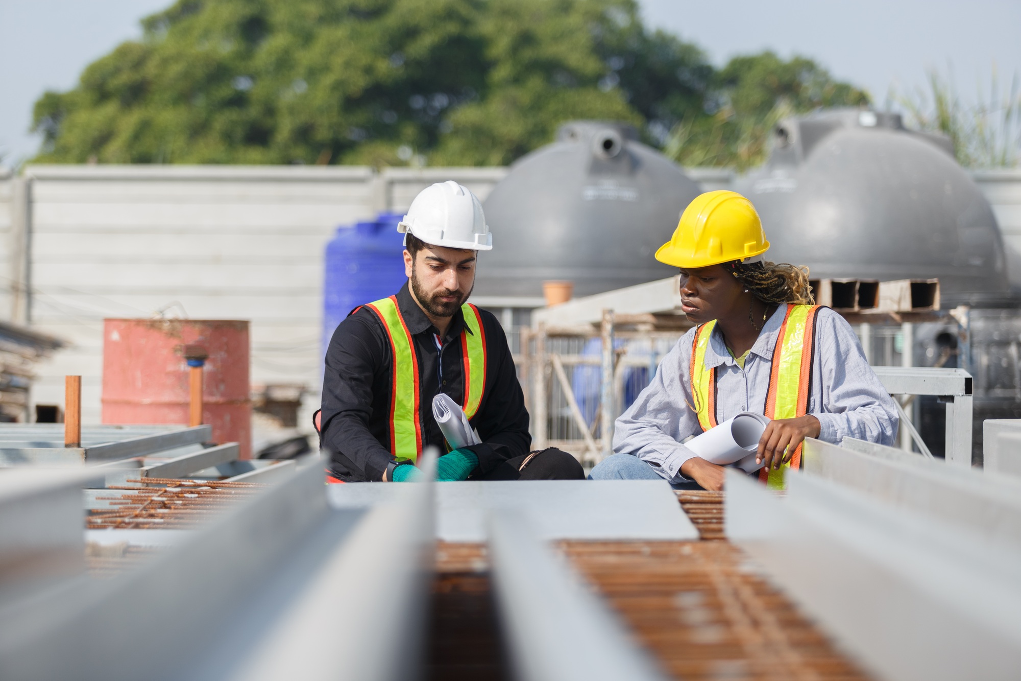 Construction civil engineer man and woman African American checking quality of work